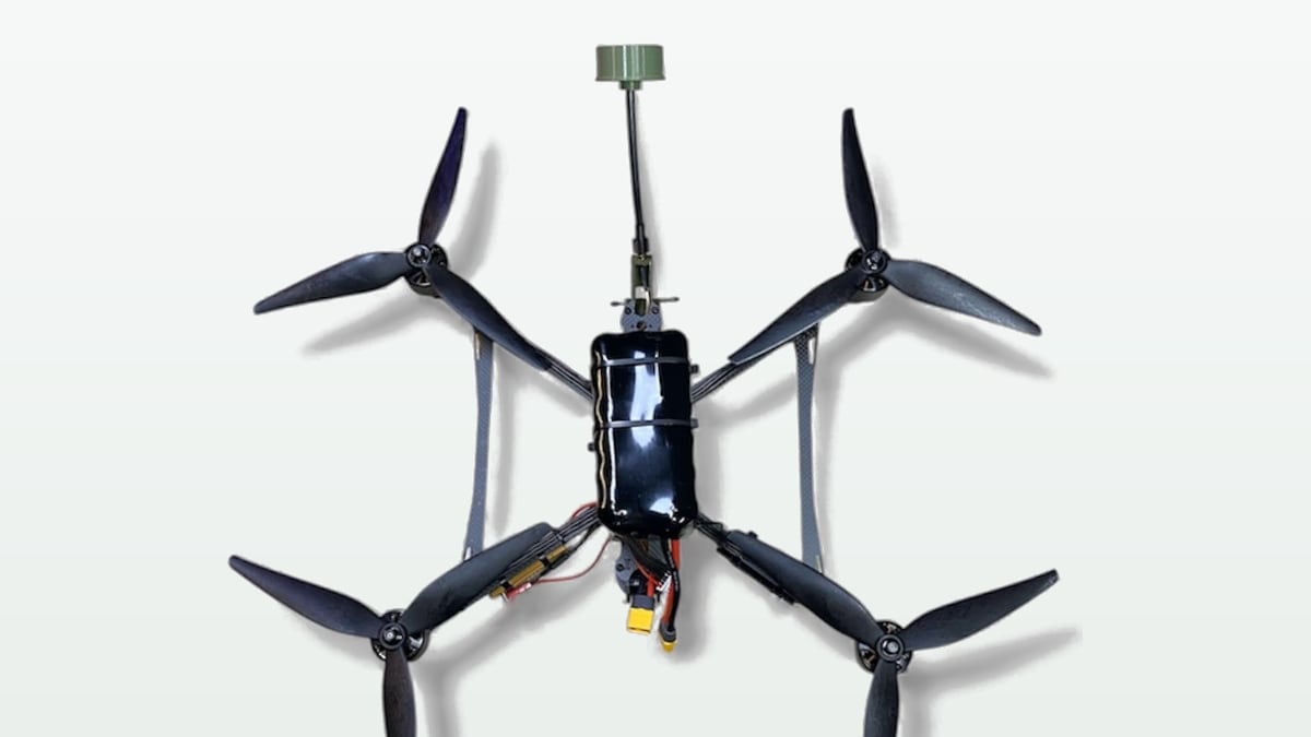 A Stealth FPV quadcopter fitted with a fiber-optic spool for hardline control