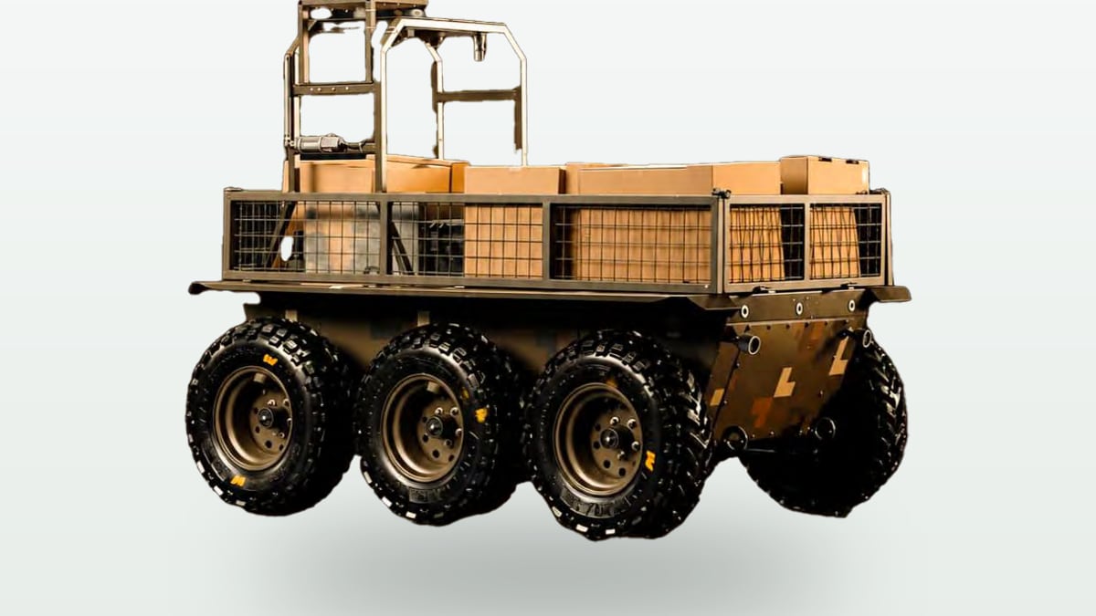 The RAVLYK 6x6 uncrewed ground vehicle in its cargo configuration, carrying a flatbed load platform